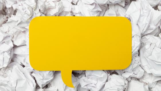 eine gelbe Sprechblase mit weißem Hintergrund