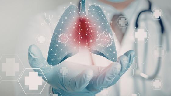 Eine Ärztin hält ihre Hand unter ein Lungensymbol