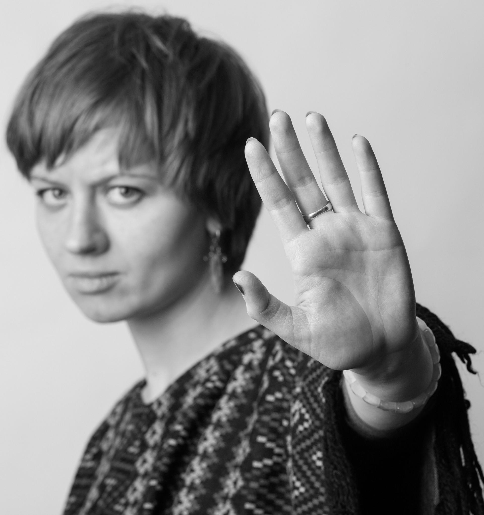 Domestic violence - woman put the palm in front of herself
